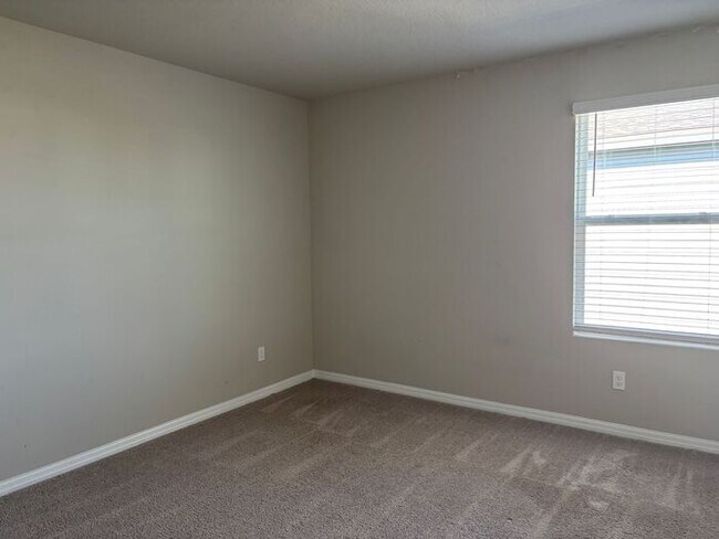Building Photo - Like-New 4 Bedroom 3 Bath with Pond View & Two Living Spaces — Minutes to South Lake Nona