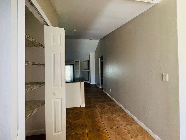 Building Photo - Experience this Cape Coral 3 bedroom 2 bath corner duplex with 1 car garage and screened in lanai.