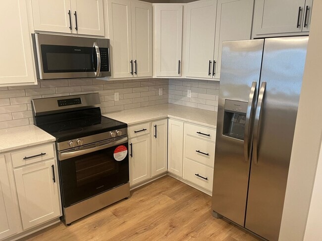 Building Photo - New Construction, 2 bed, 3 bath Row Home, with 2 car garage, fireplace, and rooftop deck!