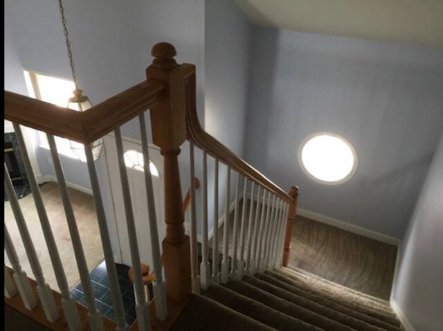 landing area on stairway with round window - 6916 Fairfax Dr