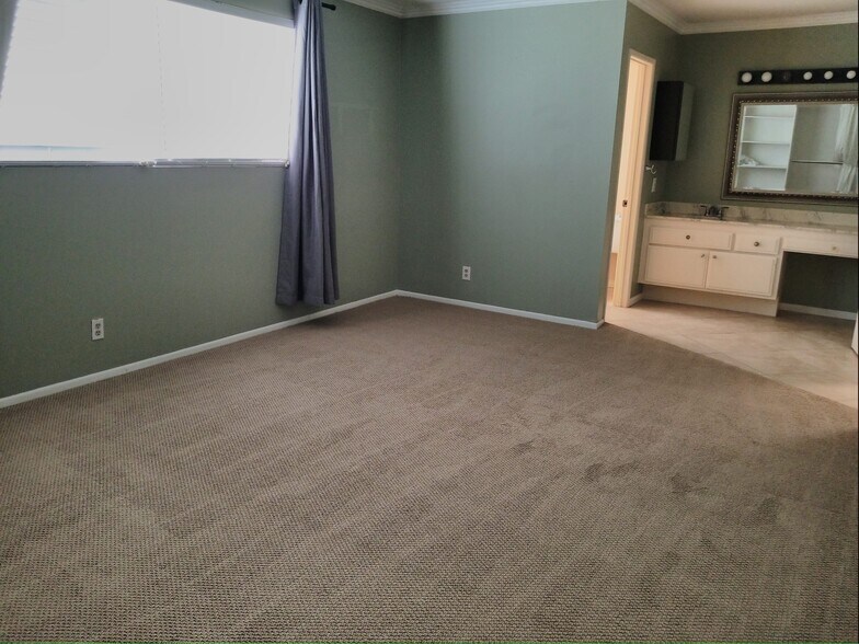 Master bathroom has skylight that opens to invite the sea air in! - 18681 Maplewood Cir