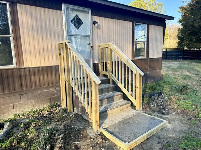 Back door entrance with new handrails - 1057 Shiloh Rd N