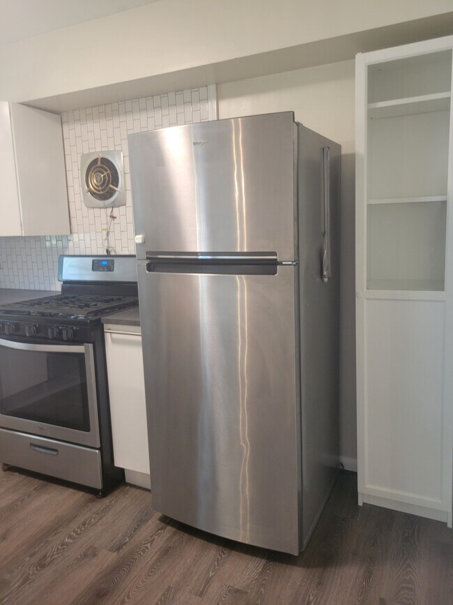 Stainless steel fridge/freezer and pantry shelf - 1043 S Trenton Ave