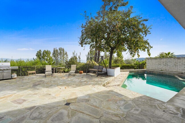 Building Photo - This stunning 5 Bed / 3 Bath Home South of Ventura Boulevard with pool and panoramic views is now...