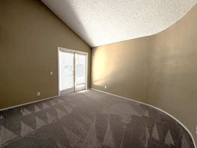 Building Photo - TWO BEDROOM TOWNHOME IN THE LAKES WITH GARAGE AND ATTACHED CARPORT