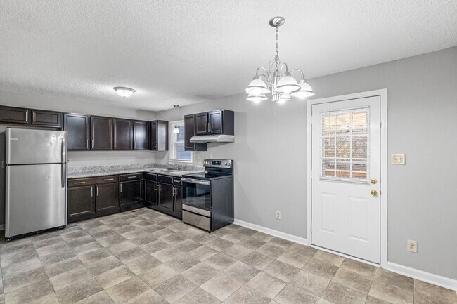 Building Photo - NE Home - Updated Kitchen and Bathrooms!  SS Appliances, Fire Place, Front Porch & Deck, Fenced Y...