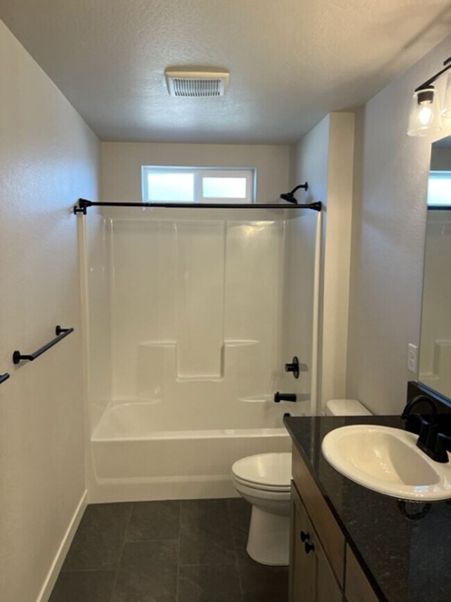 Building Photo - ALMOST NEW CONSTRUCTION/ 4 BEDROOM IN NEWER UPCOMING NEIGHBORHOOD