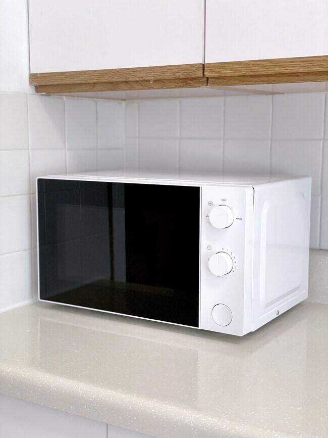New microwave. - 7718 Royal Ln