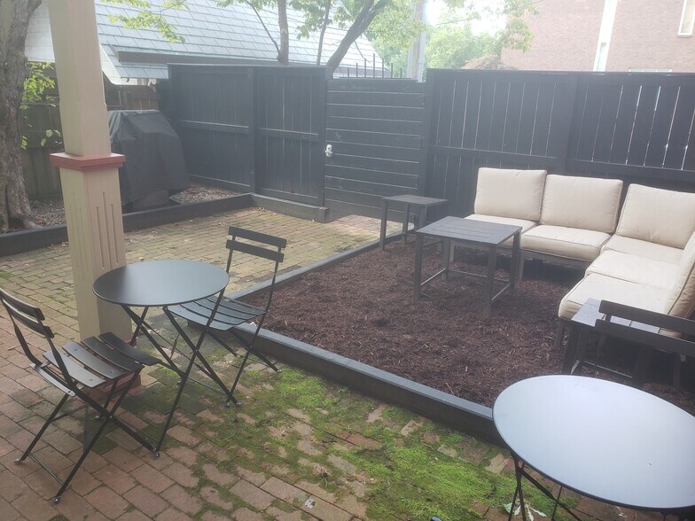 Gated back yard with grill and seating - 1323 Eutaw Pl