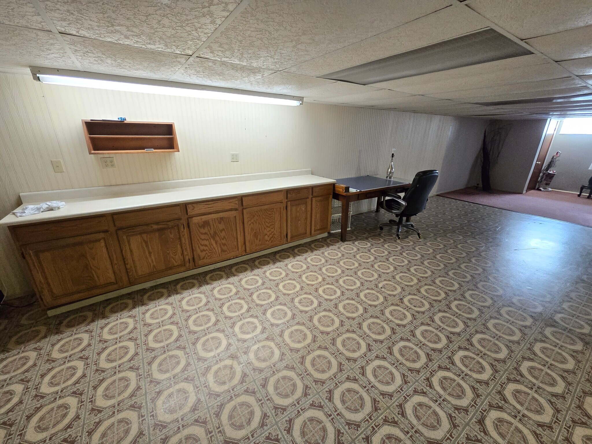 Mini kitchen for small fridge, microwave. Study area. - 6874 Joanne Cir N