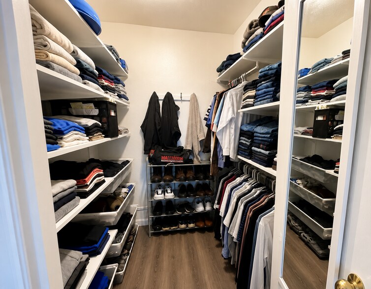 Primary closet, includes closet organizer. - 1630 S Deframe St