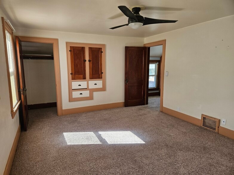 Upstairs bedroom with two closets and built in storage - 4047 Mogadore Rd