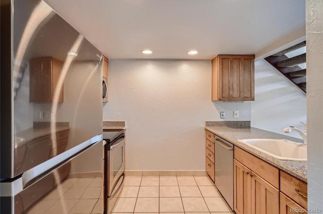 Kitchen with new stainless steel appliances - 14282 E Tufts Pl