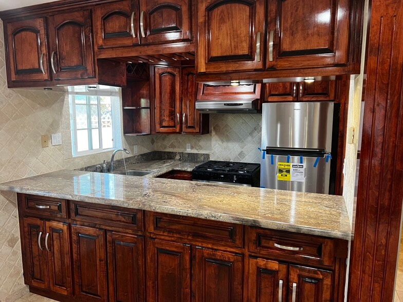 Kitchen with new refrigerator and range - 148 Van Nuys Ave