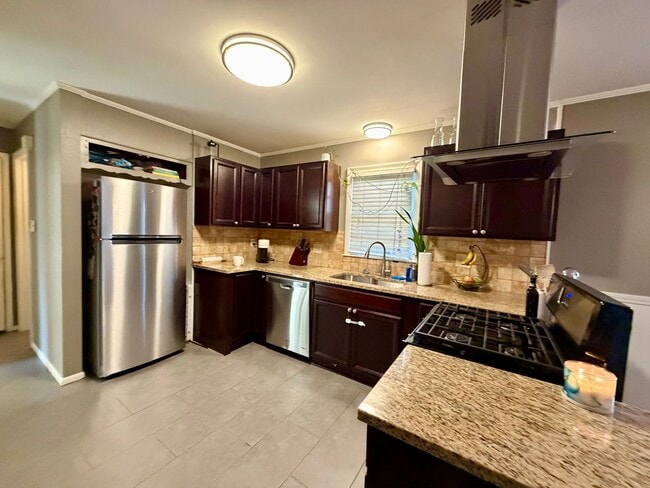 Building Photo - {7710} Prairie Village Split Level with Two Car Garage + Two Full Bathrooms + Hardwood Floors + U...