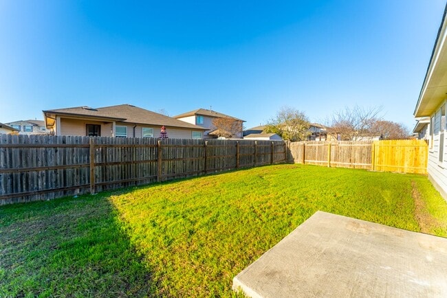 Building Photo - Charming Brick Home with Open Floorplan, Vaulted Ceilings, and Luxurious Amenities—Perfect for An...