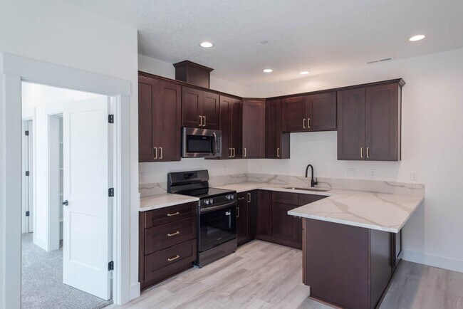 Building Photo - NEW CONSTRUCTION 1BD W/GARAGE & YARD