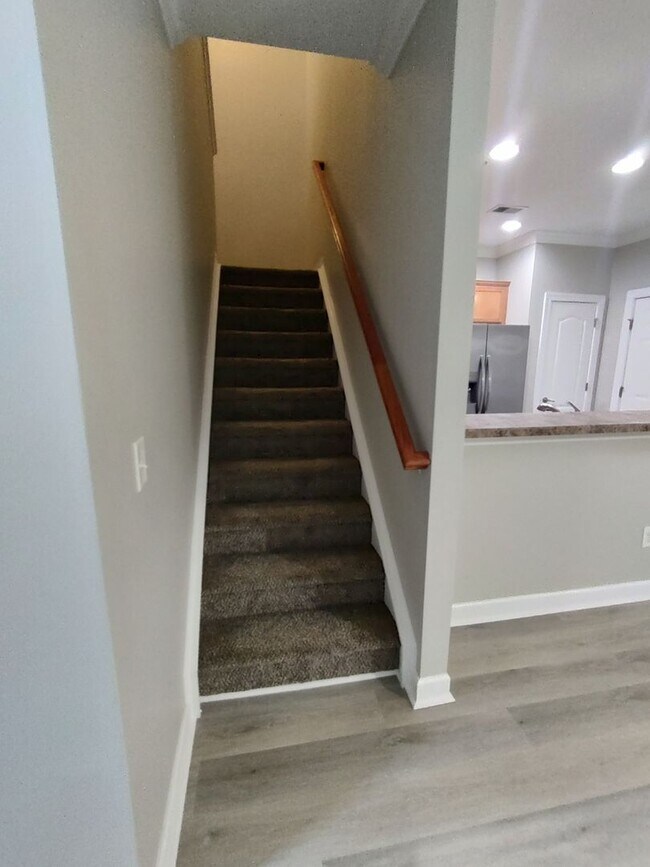 Building Photo - BRAND NEW FLOORING & FRESH PAINT - 3 Bedroom/2.5 Bath Townhome with garage in Wild Wing!