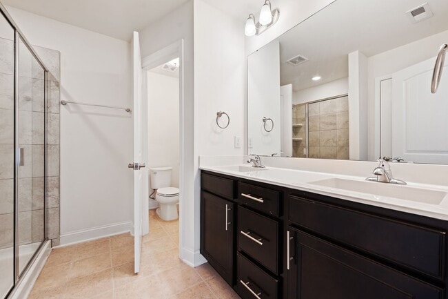 Building Photo - Stylish and Spacious 3 Bedroom, 2.5 Bathroom End-Unit Townhome w/ Garage!