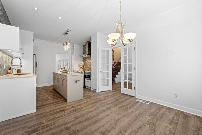 Building Photo - Rare Luxury 3-Story Townhome in Walton School District – Dual Kitchens, Double Decks & More!