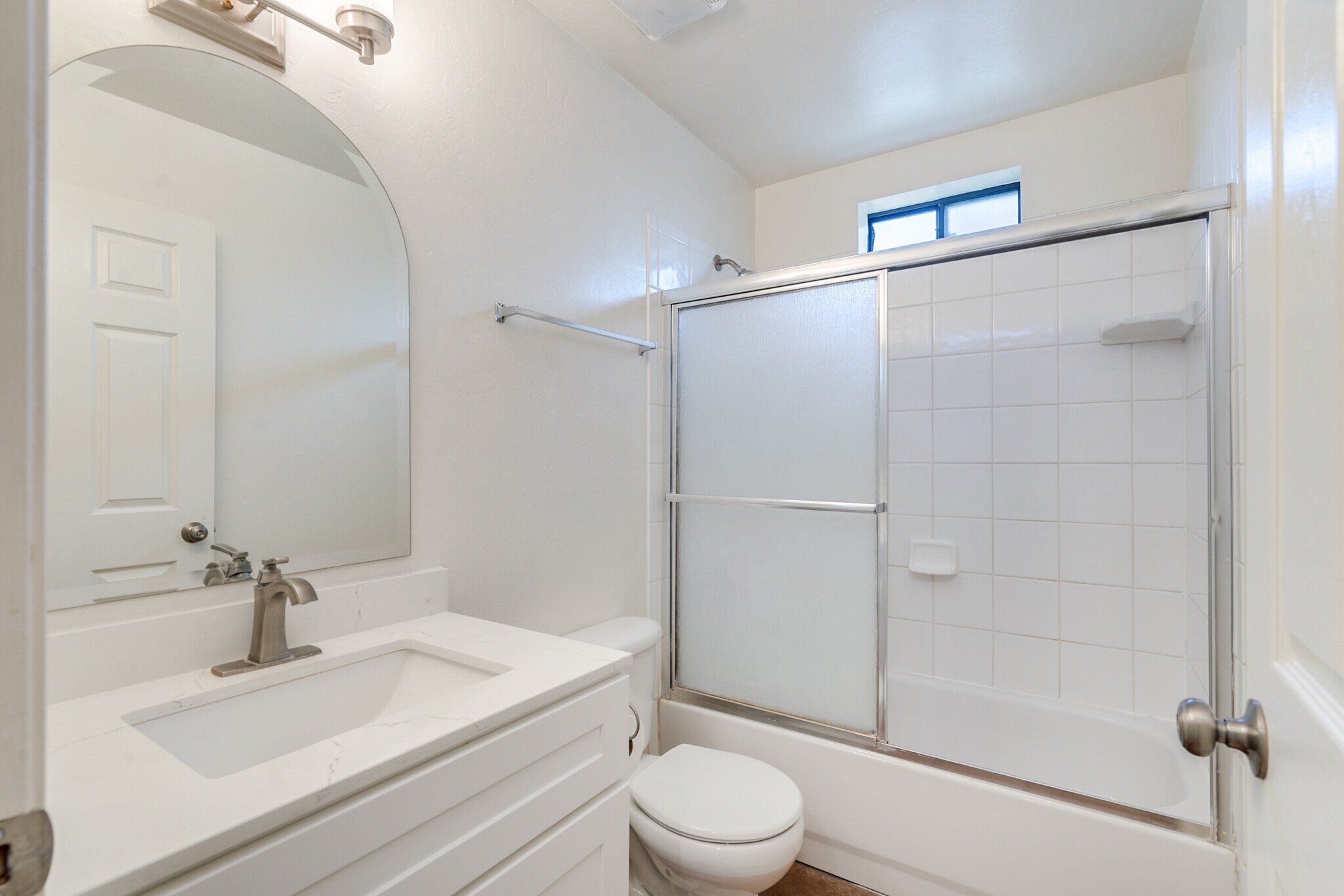 Bathroom 1 with updated vanity and quartz countertops - 3138 E Adams St