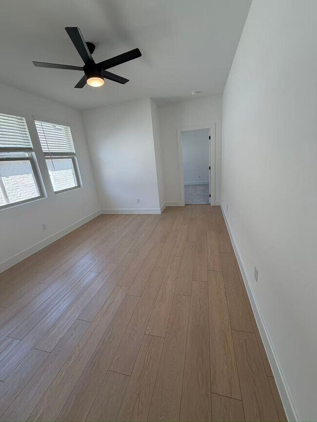 Building Photo - Move-in ready and like-new! Washer, dryer, and refrigerator Included.