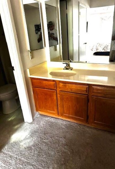 Primary bedroom has private bath and large walk-in closet - 607 S 79th Way