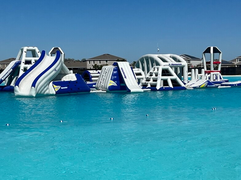 Obstacle course in lagoon also has a slide and swim up bar - 17014 Avon Dive Ln