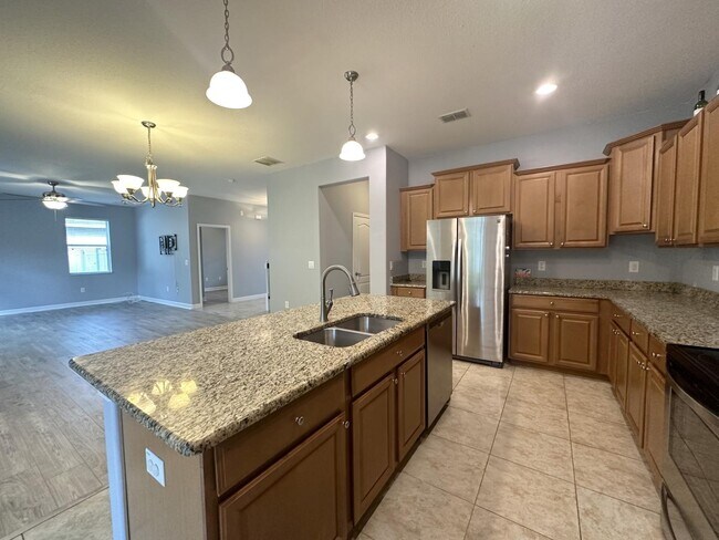 Building Photo - "Spacious 5-Bedroom Retreat with Scenic Views in The Verandahs!"