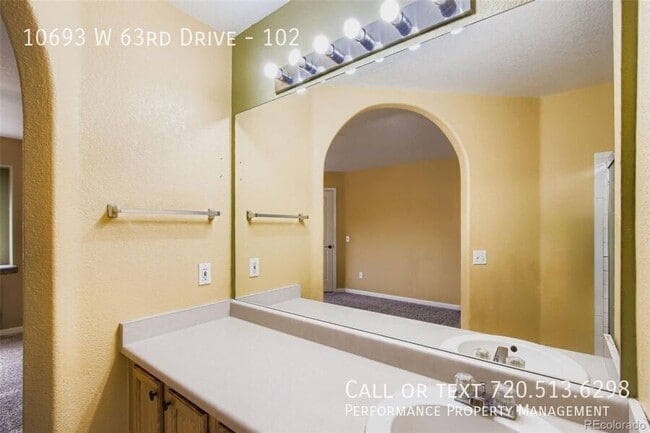 Building Photo - 10693 W 63rd Dr