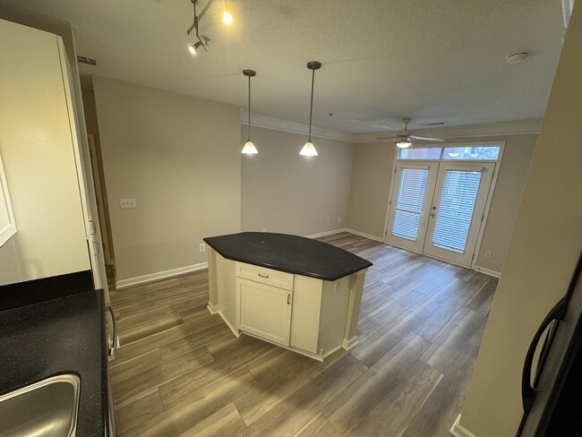 Kitchen area looking out towards french doors and courtyard - 400 17th St NW