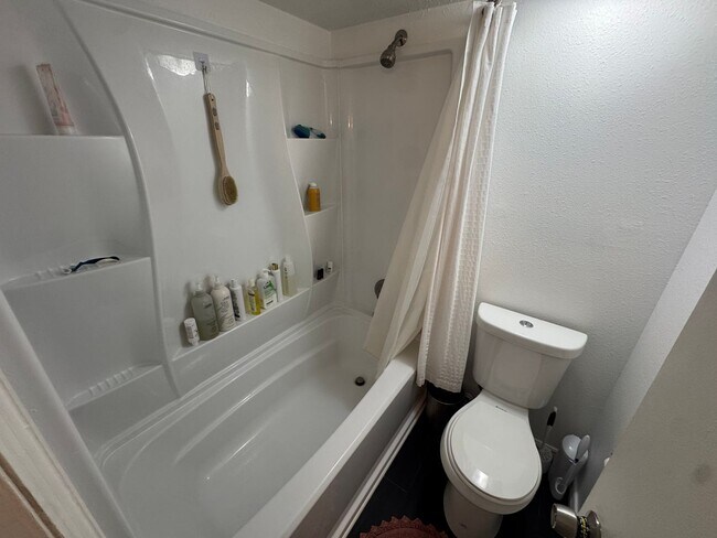 Building Photo - Bright 2BR Townhome with 3 Balconies & Private Patio