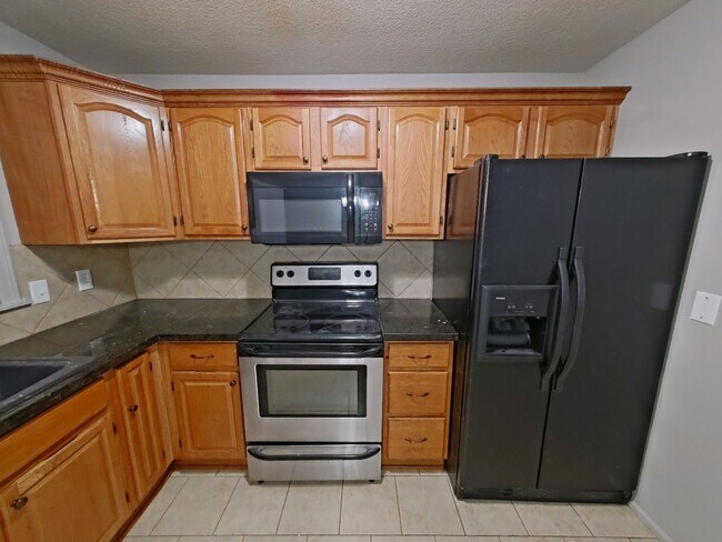 Building Photo - Spacious 3-Bedroom Home with Garage, Finished Basement & Fenced Yard