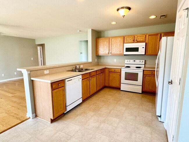 Building Photo - Like New 3 Bedroom & 2 Bath pond front home in Hillsborough! Enjoy the Community Pool, Playground...