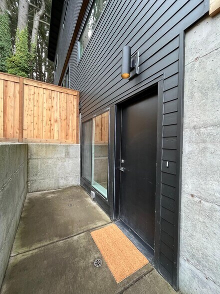 Separate entrance with small private patio - large enough for potted plants and a bistro set - 2090 NE Morgan St