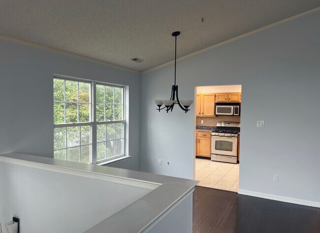 Dining area with modern lighting - 1942 Willings Ln