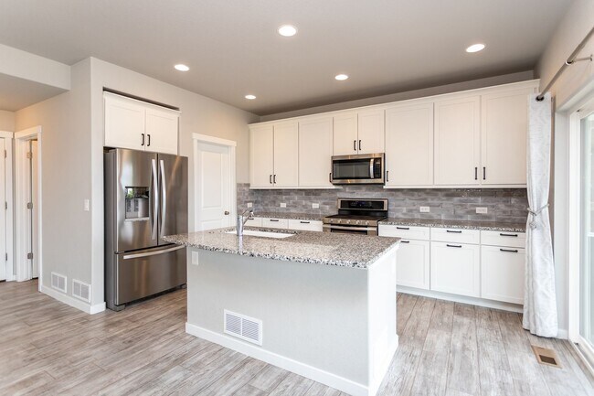 Building Photo - Spacious 5-Bedroom Home with Finished Base...