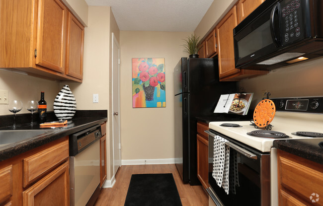 1BR, 1.5BA 845 SF - Kitchen - Windsong Village Apartments