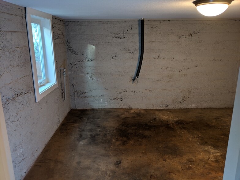 Basement bedroom (closet, heat source and egress window) - 7138 N Central St
