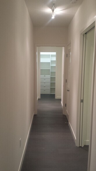 Hallway, with walk-in custom storage closet at the end. - 1515 15th St