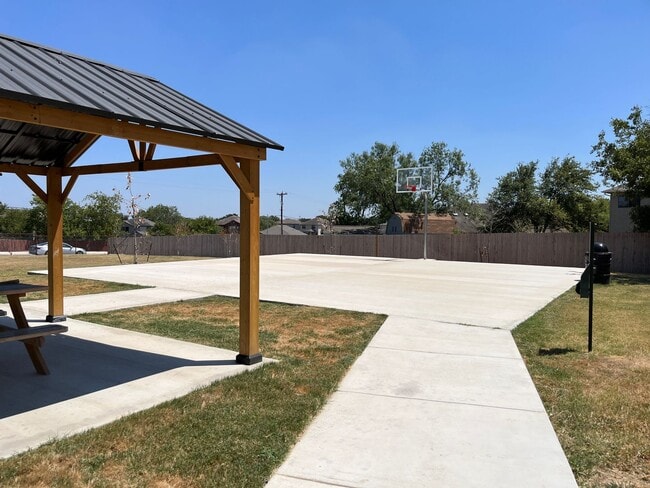 Building Photo - Move Fast! Gated Townhome Near Lackland AFB with Private Yard & EV-Ready Garage