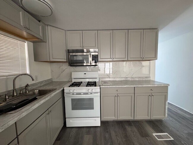 Building Photo - Parially Furnished 2BR 1BA Remodeled-Fenced Yard + RV/Coach cement Parking