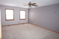 Building Photo - Rare find-3 Bedroom spacious corner unit with Den, 2.5 baths and 2 car garage