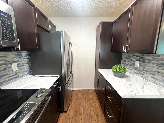 Building Photo - Two Stories 2 Bedroom 1.5 Bath Condo Home for rent near Domain,  Ground Floor with Balcony, Gated...