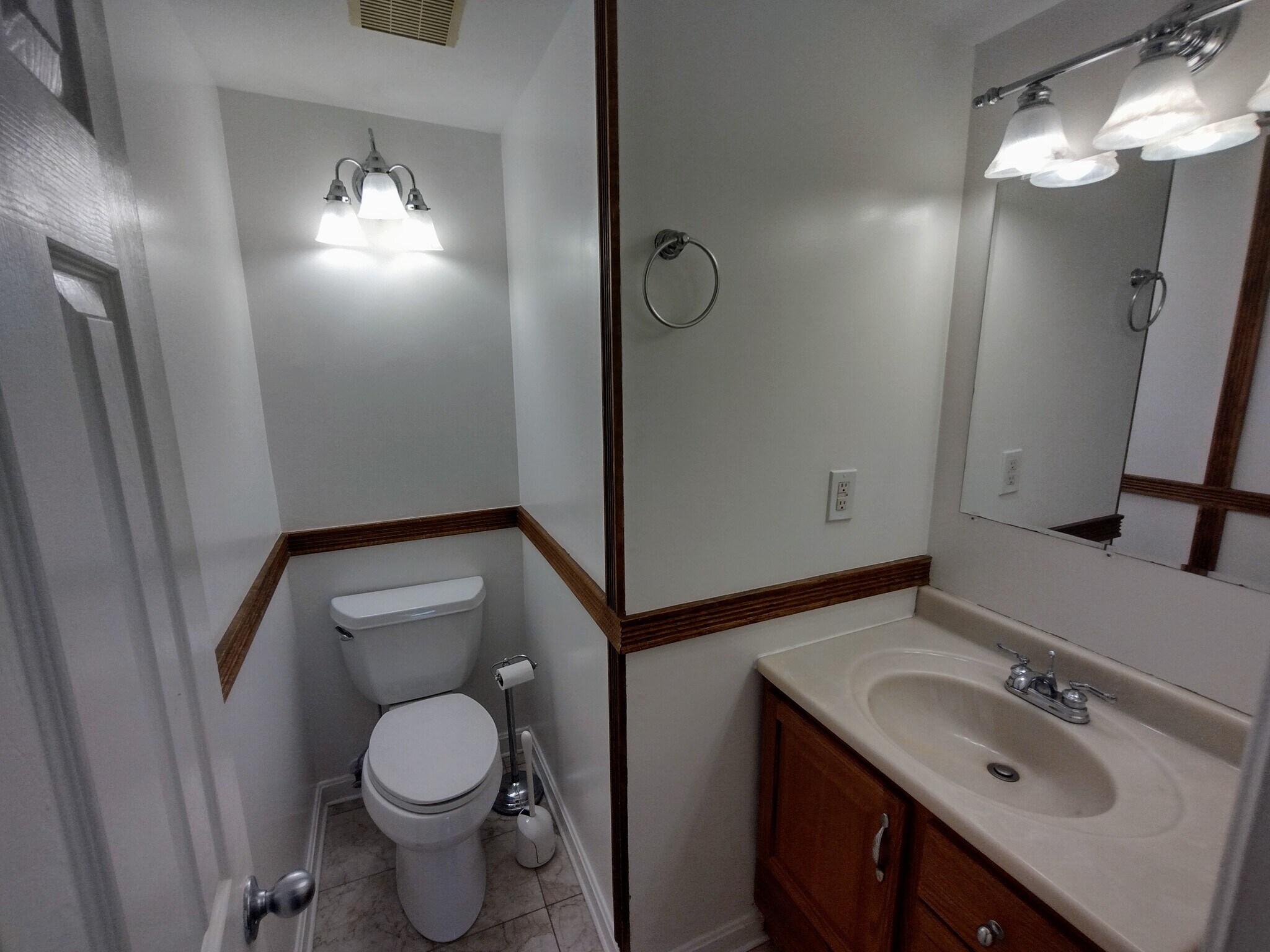 First-Floor Half Bath Conveniently located half bathroom just off the dining room _ perfect for gues - 1933 4th St NW
