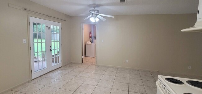 Building Photo - CHARMING SE 3/1.5 w/ Garage, Washer/Dryer, Large Privacy Fenced Yard, & Tile Floors Throughout! A...