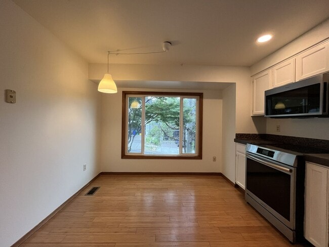 Building Photo - Spacious 3-Bedroom Home with Custom Stone Fireplace, Attached 2-Car Garage & Expansive Backyard i...