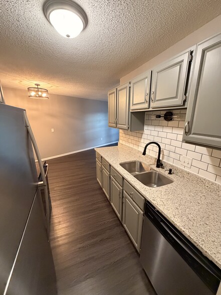 View from entry hall thru kitchen to the dining room. - 8935 Old Cedar Ave S