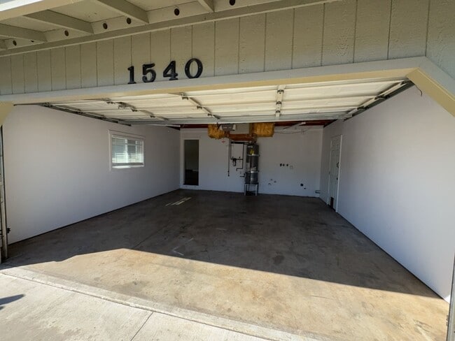 Building Photo - Newley updated 3-bedroom home features fenced yard, garage, and covered patios!