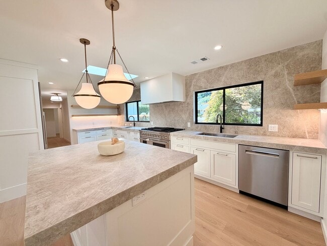Building Photo - This premier 4-bed, 3-bath estate spans 2,565 sq. ft. on a 10,253 sq. ft. lot in North Los Altos.